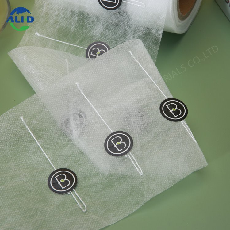 Khoom noj khoom haus qib PLA Tsis Woven Fabric Yob nrog daim ntawv lo thiab xov rau kas fes thiab tshuaj yej hnab